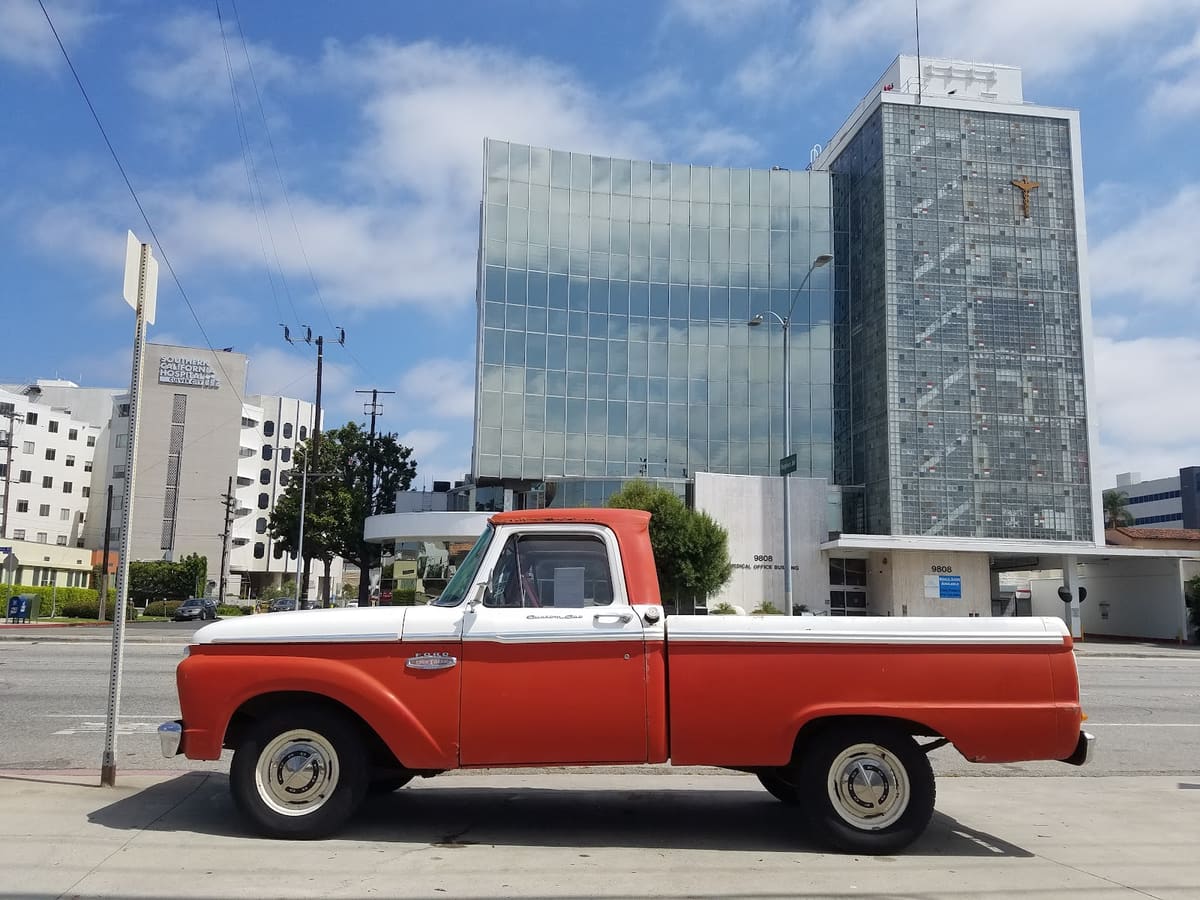 Classic red and white Ford Custom Cab pickup bought by 805 Cash For Cars