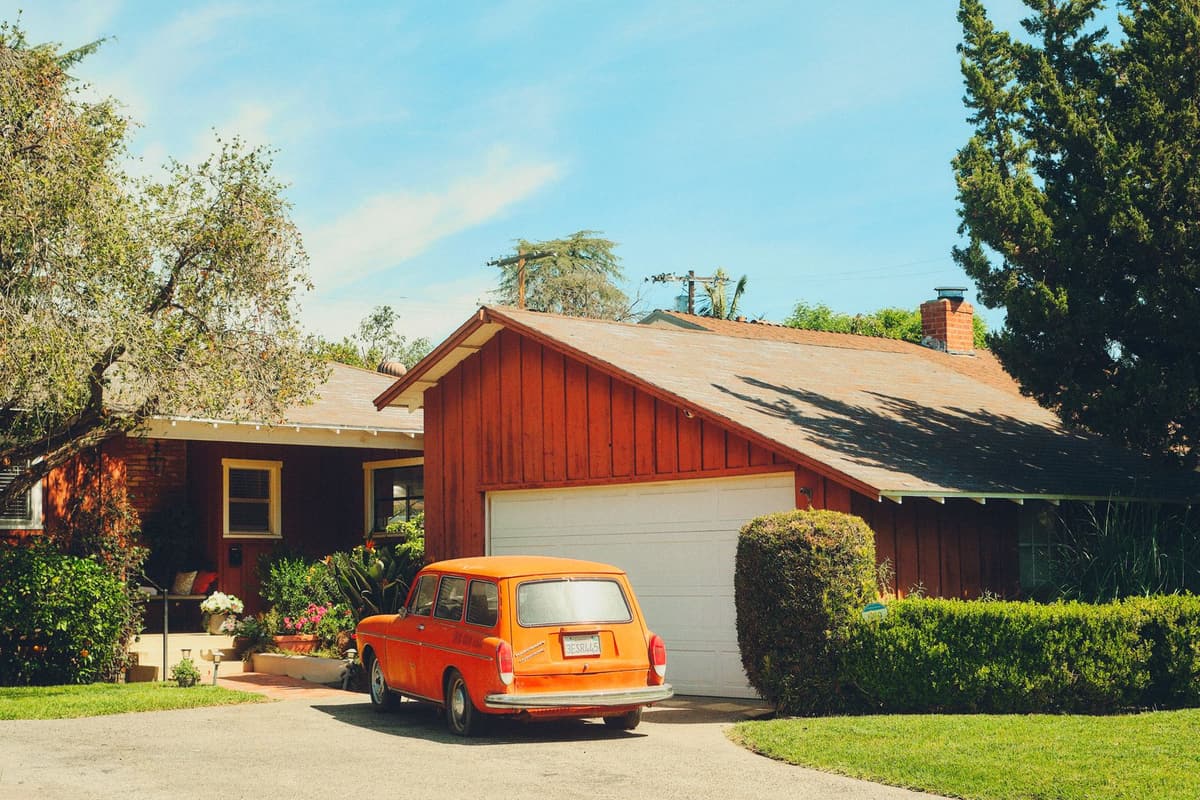 Car sitting in a suburban driveway — we buy these every week